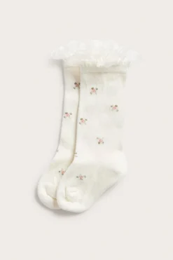Blommiga knästrumpor med volang