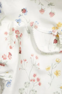 Blommig body med puffärm