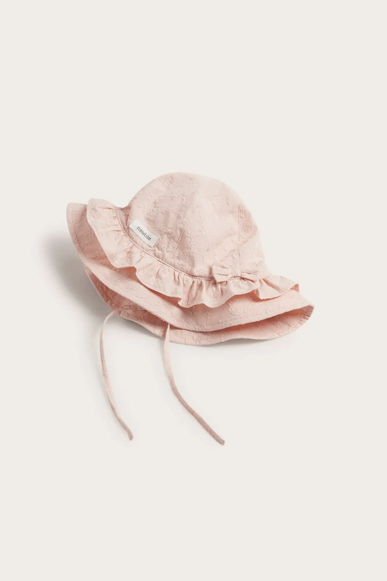 Blommig solhatt med rosett
