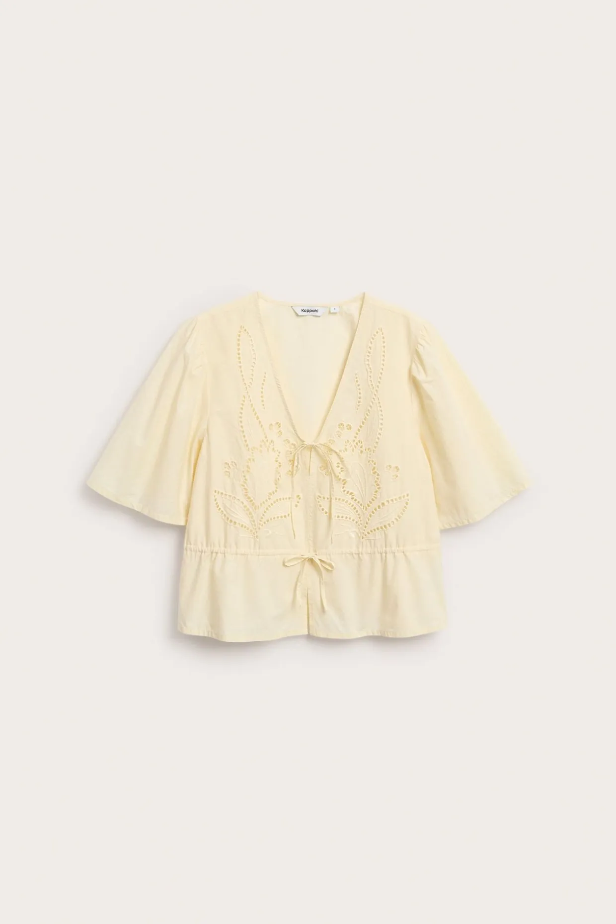 Blus i bomullspoplin med broderi och knytband