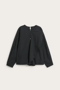 Blus med avtagbar volang
