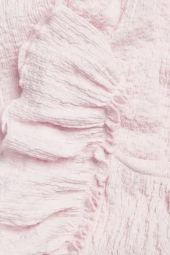 Byxdress i jersey med volanger
