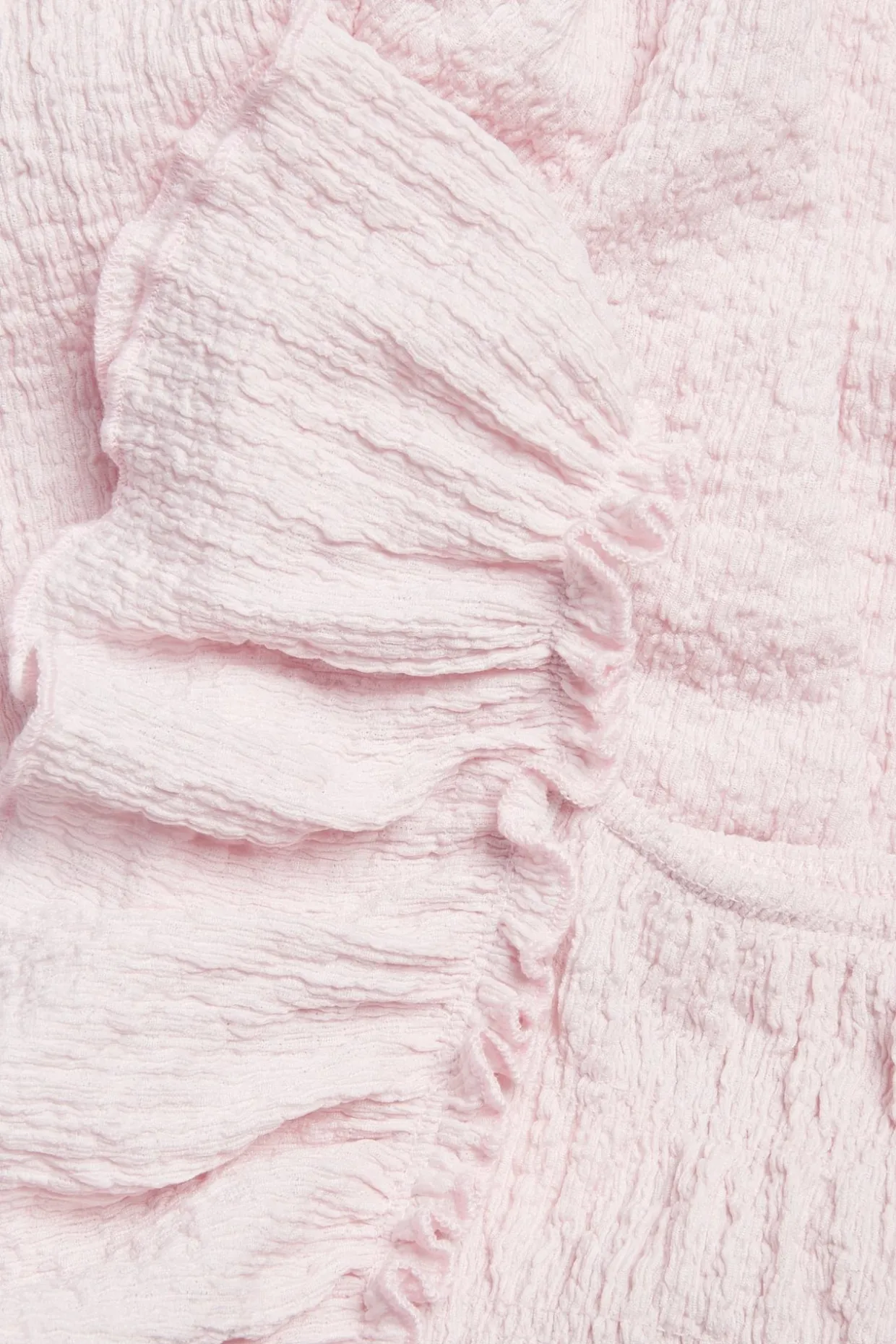 Byxdress i jersey med volanger