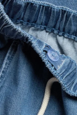 Denimbyxor med dragsko