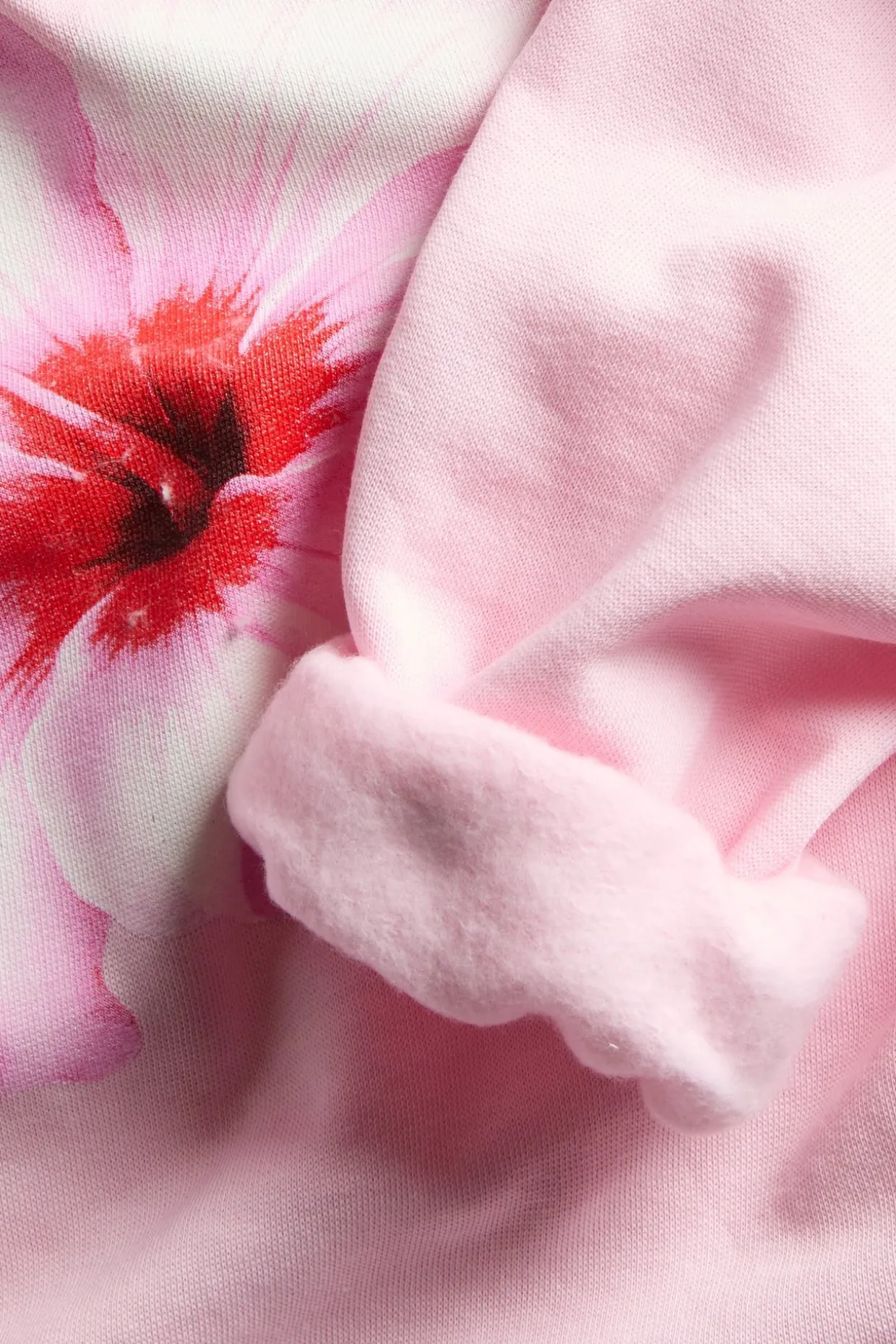 Hoodie med print av hibiskusblomma
