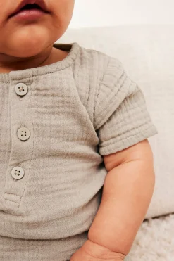 Kortärmad body i muslin