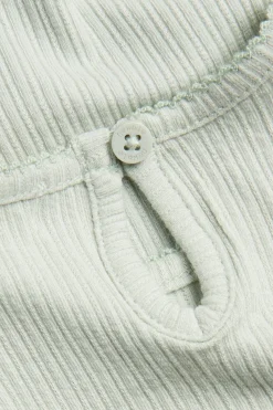 Kortärmad body med puffärm