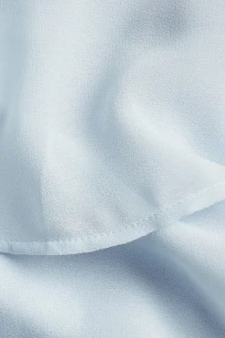 One shoulder-klänning med volanger