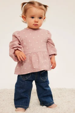 Peplumblus för baby i mjuk muslin