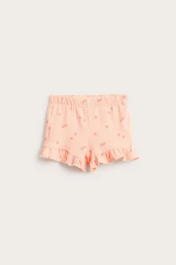 Shorts med persikomönster och volangkant
