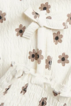 Småblommig jumpsuit med rosetter