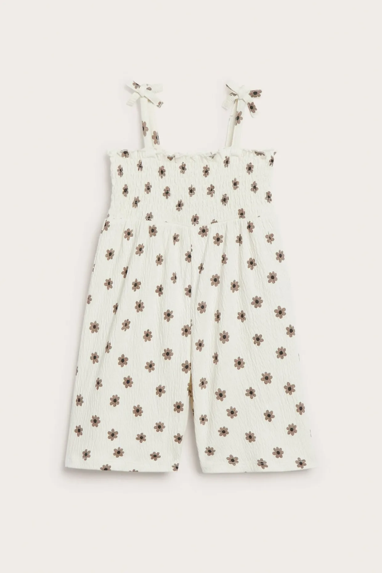 Småblommig jumpsuit med rosetter