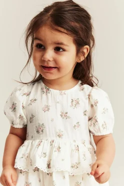 Småblommig jumpsuit med volang