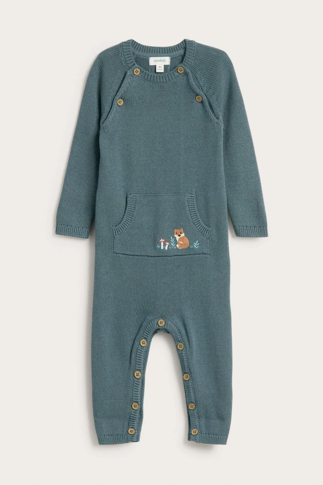 Stickad jumpsuit med broderi