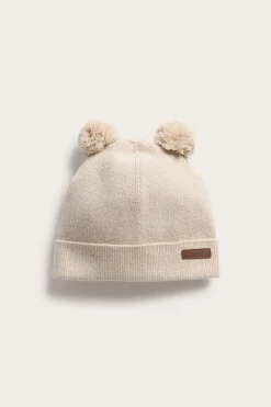 Stickad mössa med pom poms