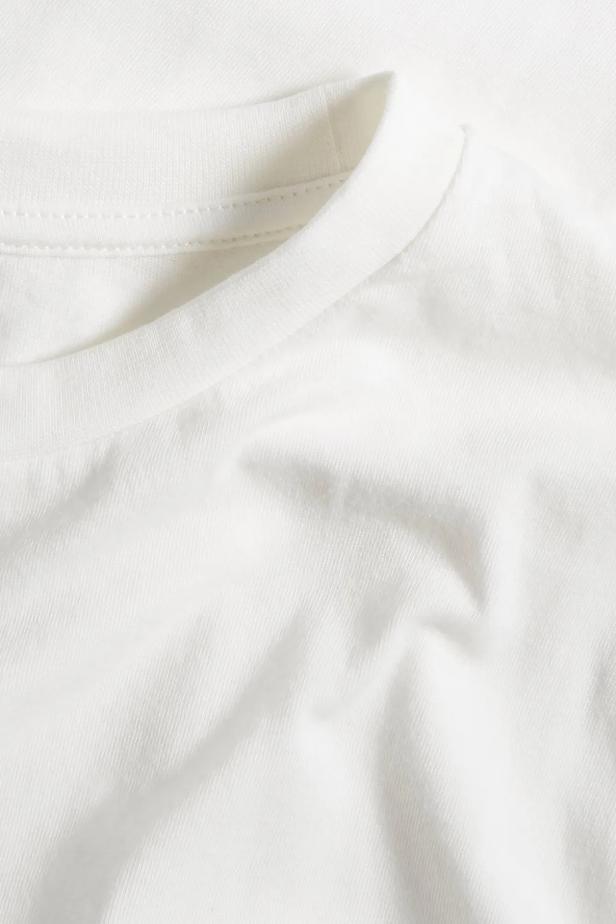 T-shirt i bomullstrikå med kort ärm