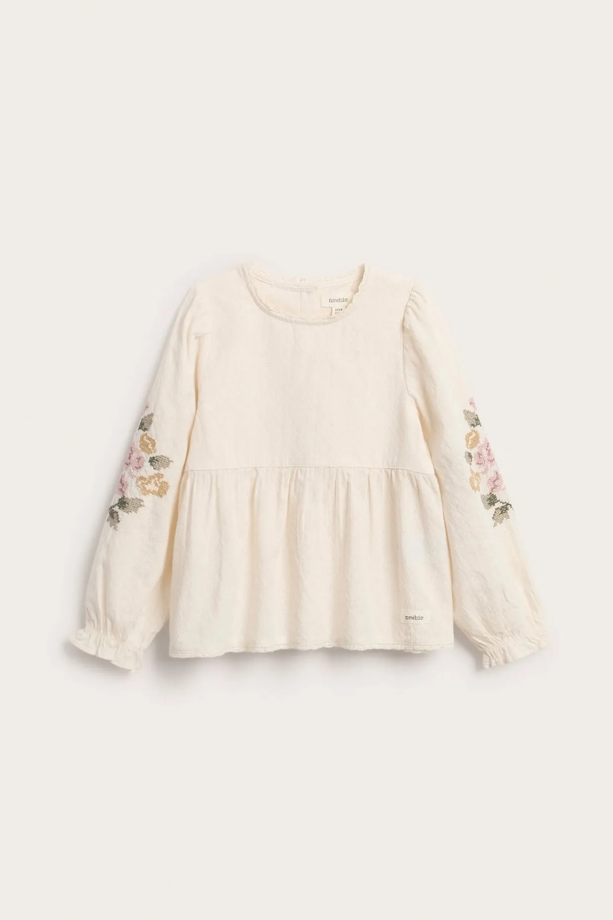 Vävd blus med blombroderi
